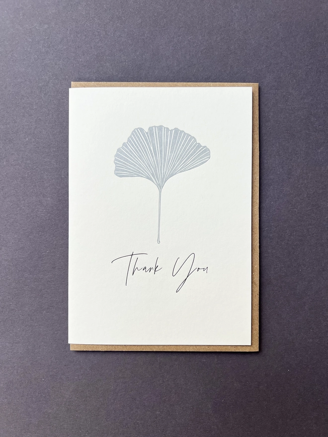 A simple but pretty metallic silver Ginkgo leaf with "Thank you" underneath.