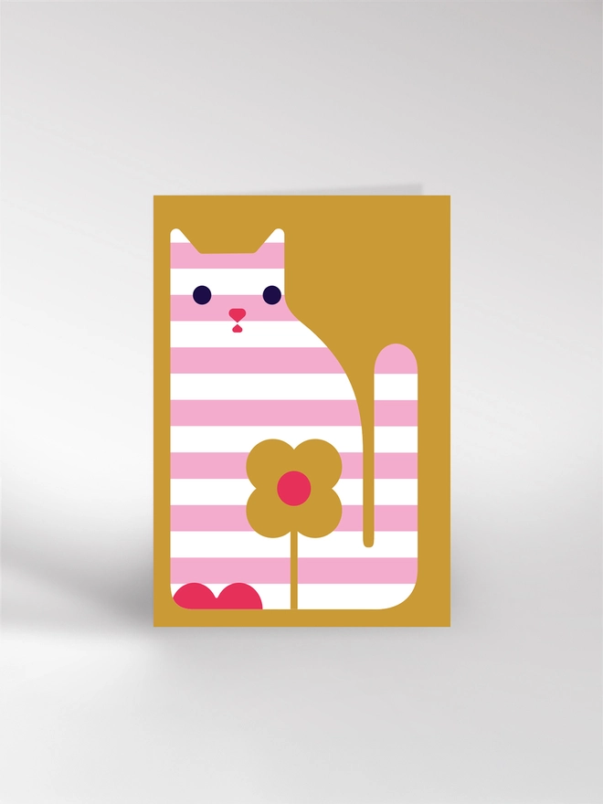 Greeting card featuring an illustration of a stripy cat with a flower