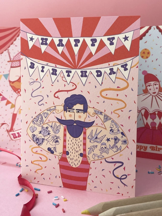 Tattooed Strongman Birthday Card
with pink background