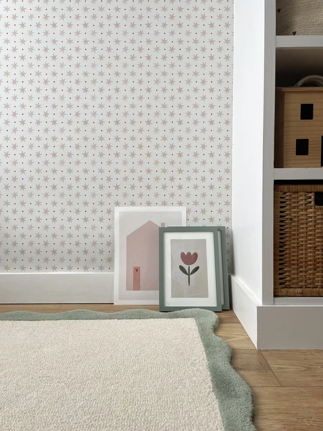 Ducks In A Row Stars and Spots Kids Wallpaper Blush Pink in girls bedroom with scalloped rug and shelving