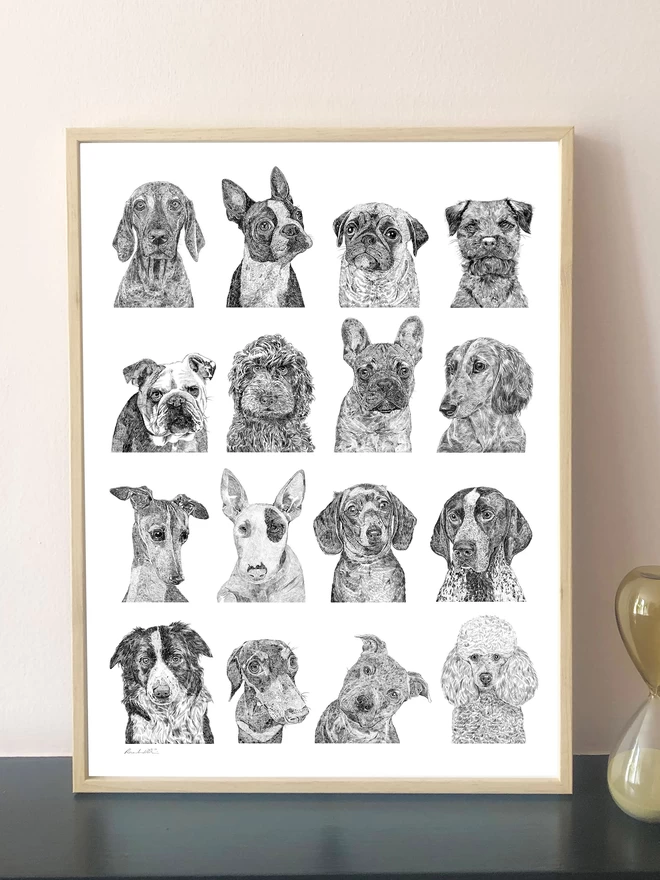 Art print of a collection of dog portraits displayed in a frame
