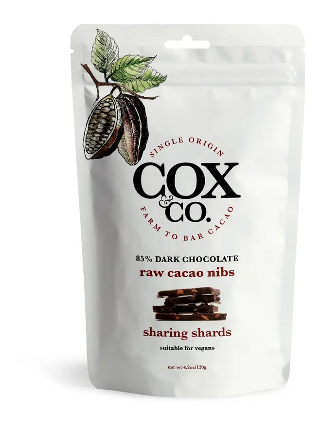 Cox&Co Sharing Shards Pouch - Raw Cacao Nibs, a chocolate pouch sat on a white table. 