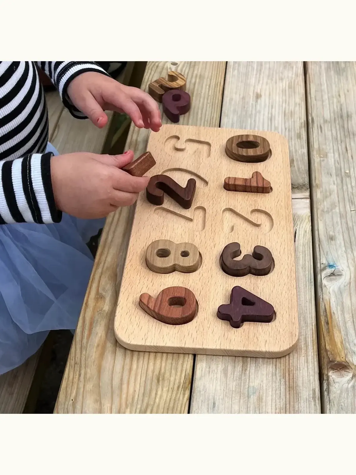 Wooden Number Puzzle Heirloom Toy, on a table. 