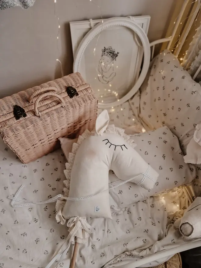 Handmade Cotton Hobby Horse Nursery Decoration, a cotton hobby horse sitting in a child's bedroom surrounded by other bedroom accessories. 