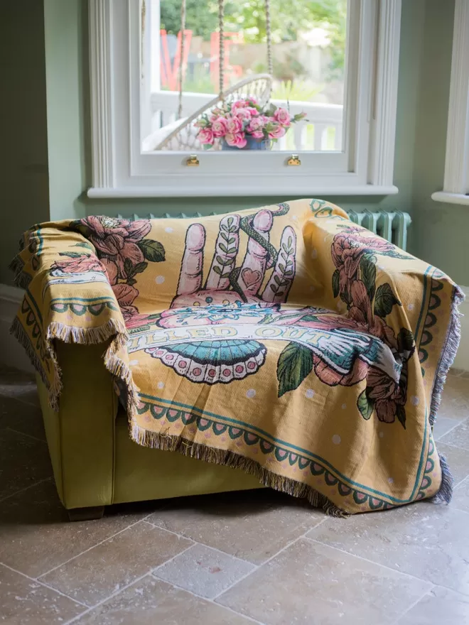 Chilled Out Woven Cotton Throw seen on a chair.