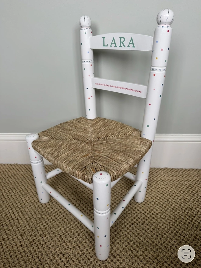 Polka dot design on a christening chair. 