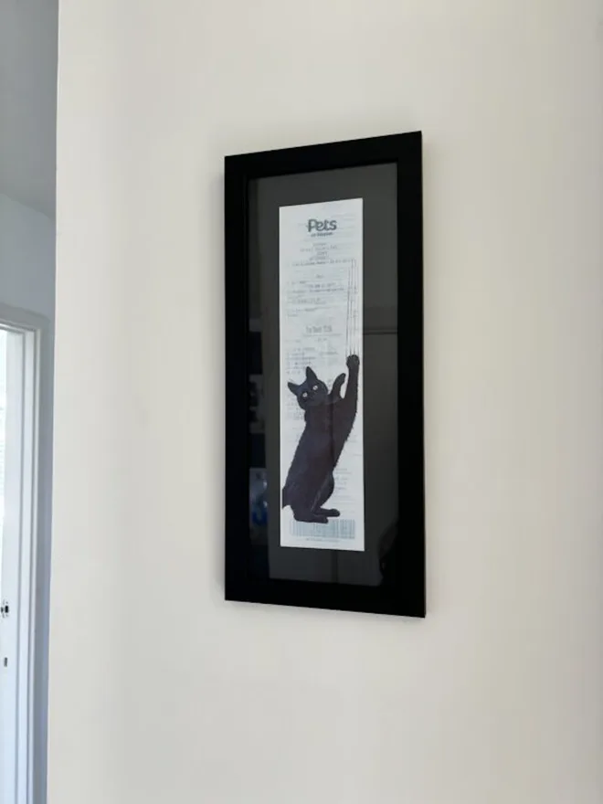 Where’s the Dreamies? Cat Print, against a white wall. 