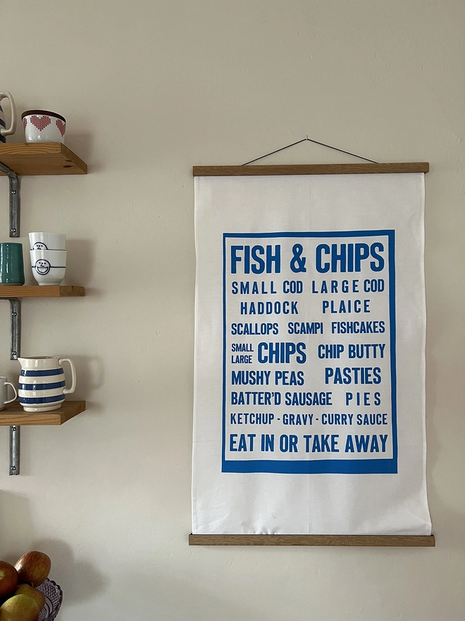 Mr.PS Fish & Chips menu screenprinted tea towel displayed using the optional hanger