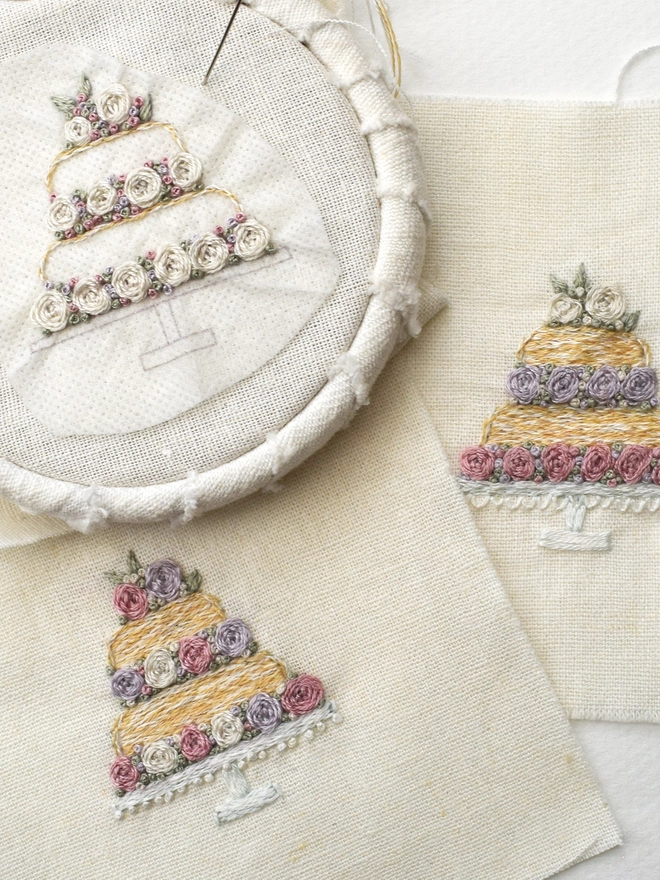 Multiple colour combinations are possible with the threads supplied.  3 examples are shown here.  Top left: work in progress, with cream roses and tiny pink and purple French knots filling the gaps.  Top right: 1 colour of rose per tier.  Bottom left: the main sample image have a mixture of colours.