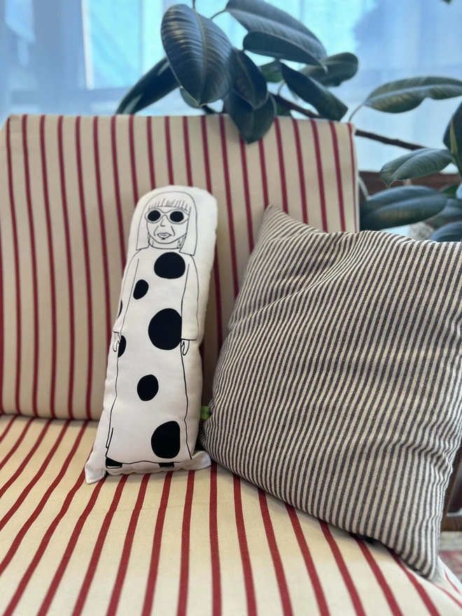 Illustrated cushion featuring the Japanese artist Yayoi Kusama