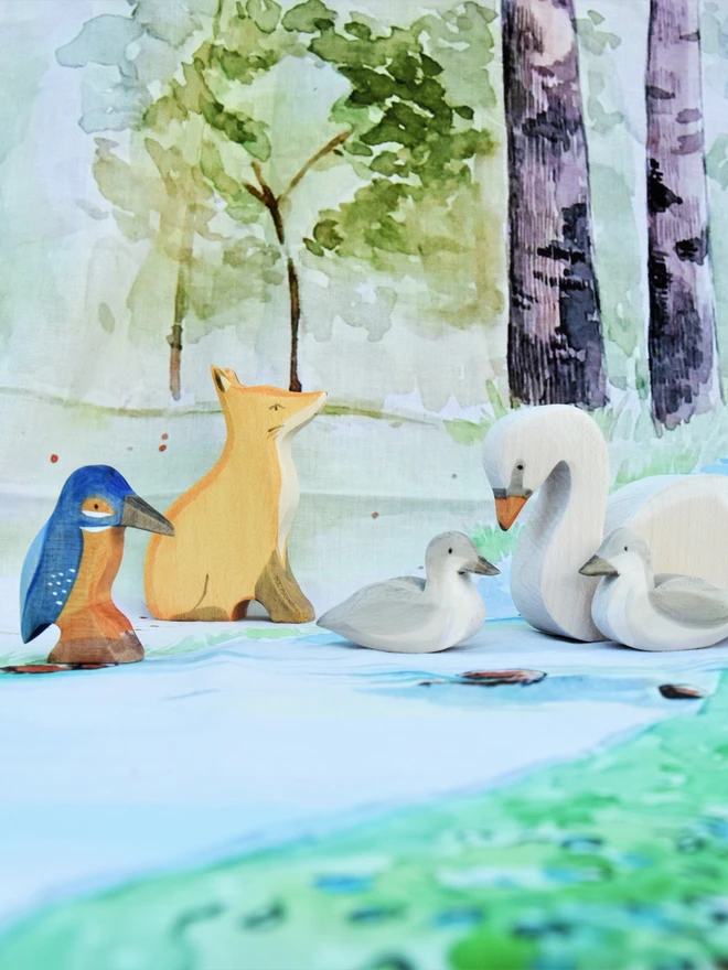 kingfisher wooden toy in woodland scene with other woodland friends fox, swan and cygnets