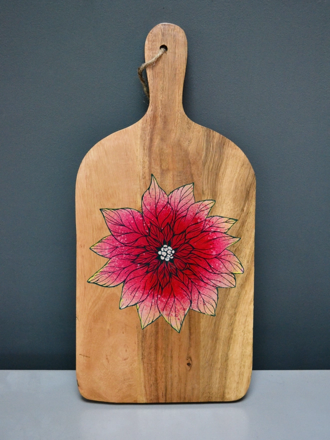 Handpainted serving board with a poinsettia design