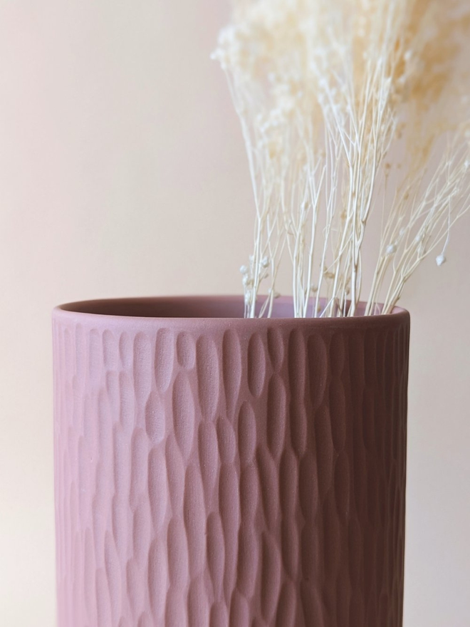 handmade textured pink vase with dried flowers