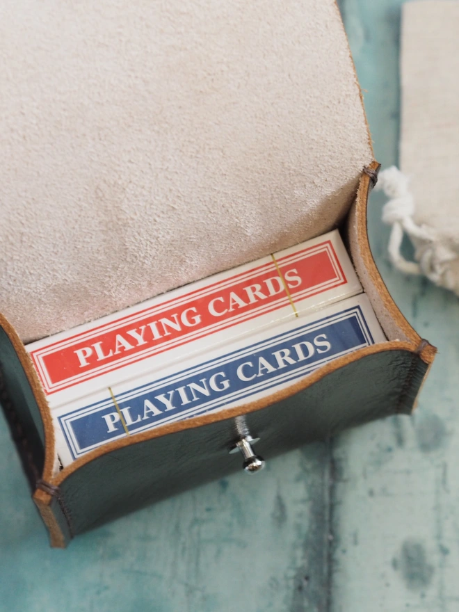 Close up of the interior of the double deck and dice holder leather case.