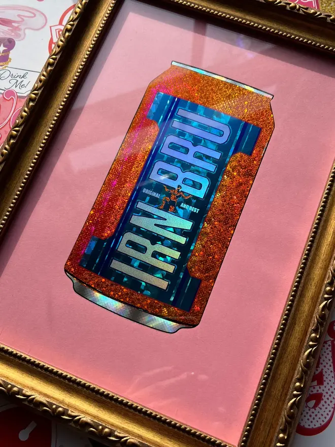 'Irn Bru' Can ScreenPrint, a colourful Irn Bru screenprint sitting framed against a colourful surface. 