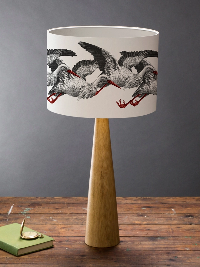 Elegant lampshade featuring elegant storks on a stylish, playful design.