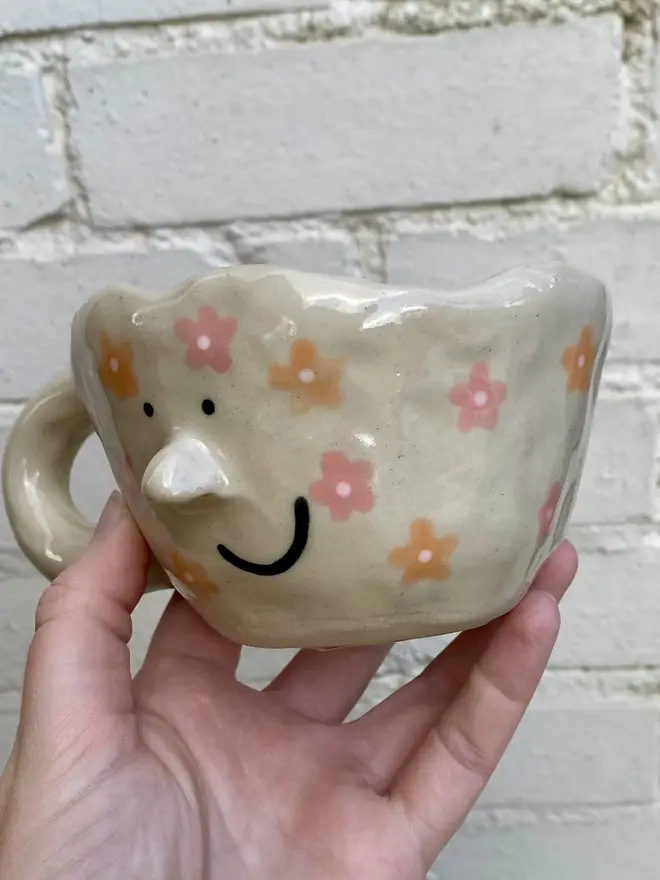 pink orange floral handmade ceramic smiley face mug