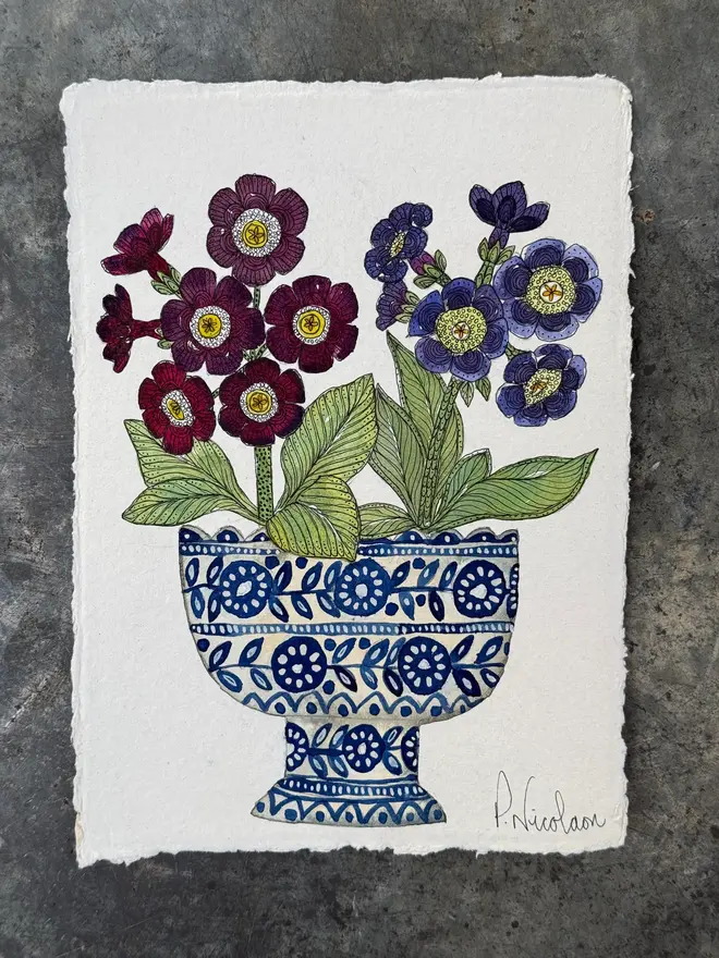 Auricular flowers in blue & white ceramic vessel