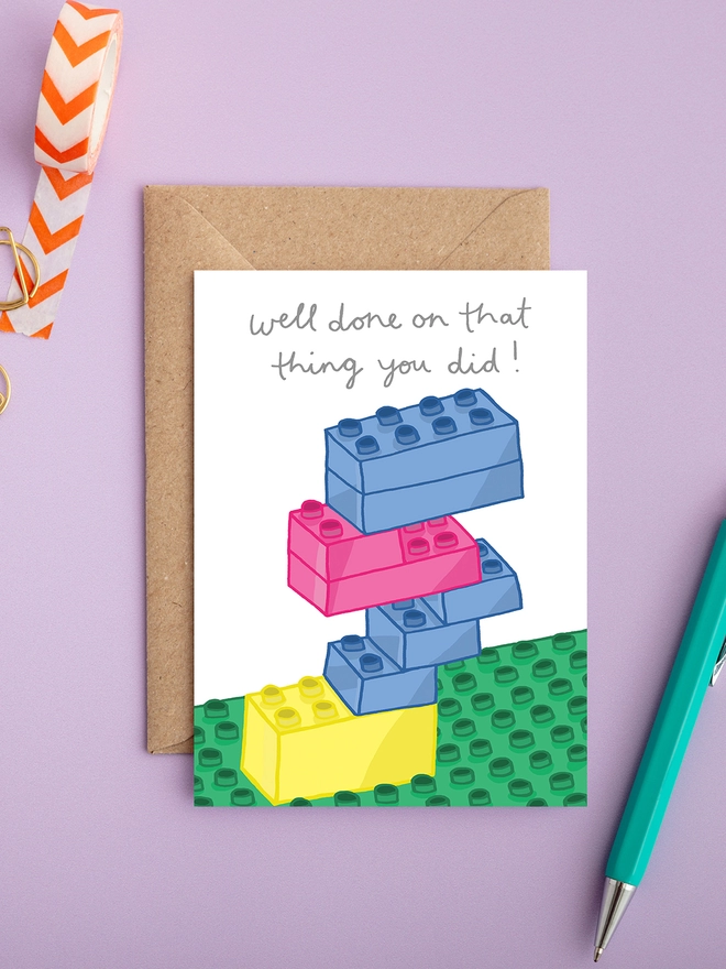A bright and colourful congratulations card featuring lego bricks 