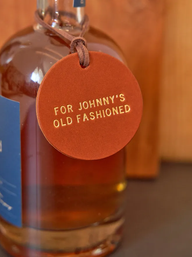 Old fashioned round personalised bottle tag