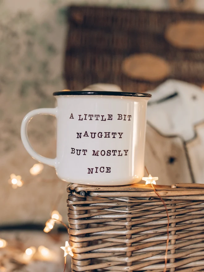 Christmas ceramic mug on wicker basket