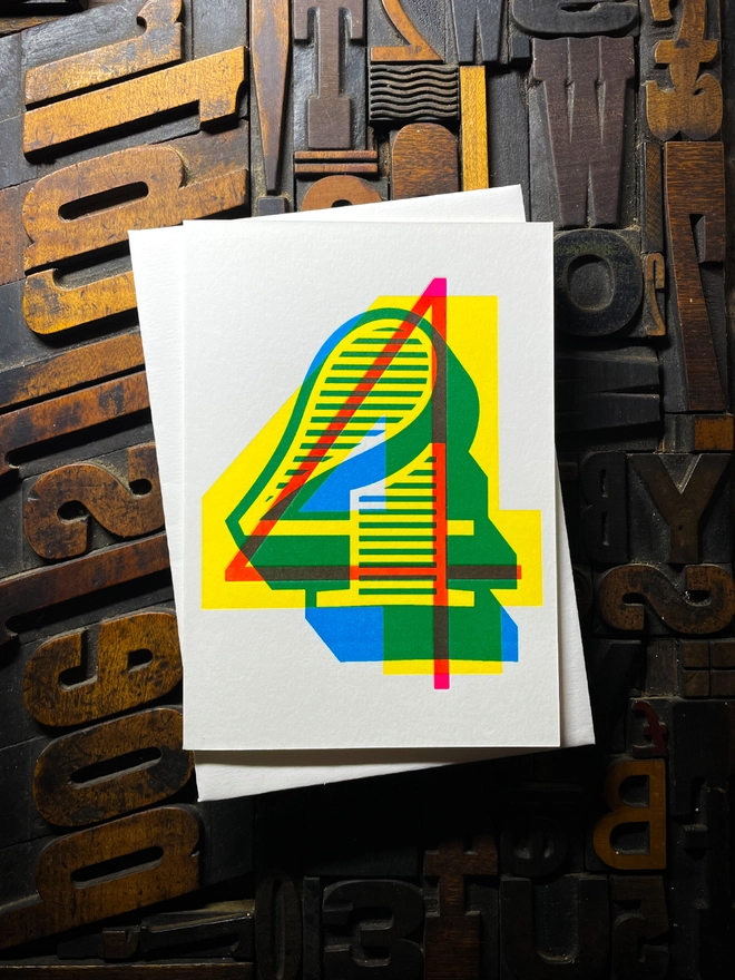 4th birthday anniversary milestone typographic letterpress card with deep impression print. Very colourful and vibrant. They show slight colour variations adding to the style anding to the charm of this handmade greeting card.