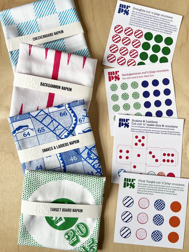 4 Mr.PS Board Game Napkins with their corresponding cut out counter cards
