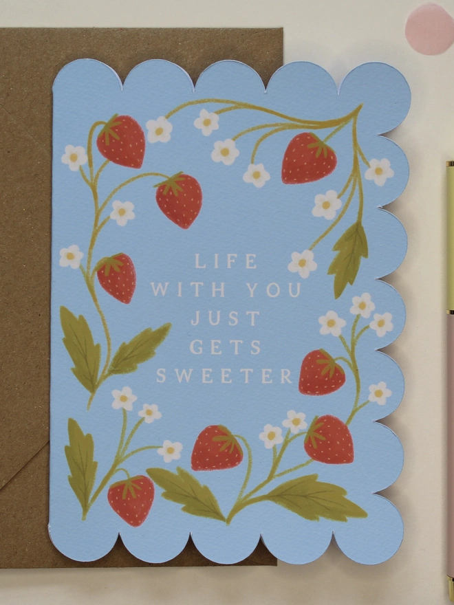 illustrated strawberry anniversary card with scalloped edge