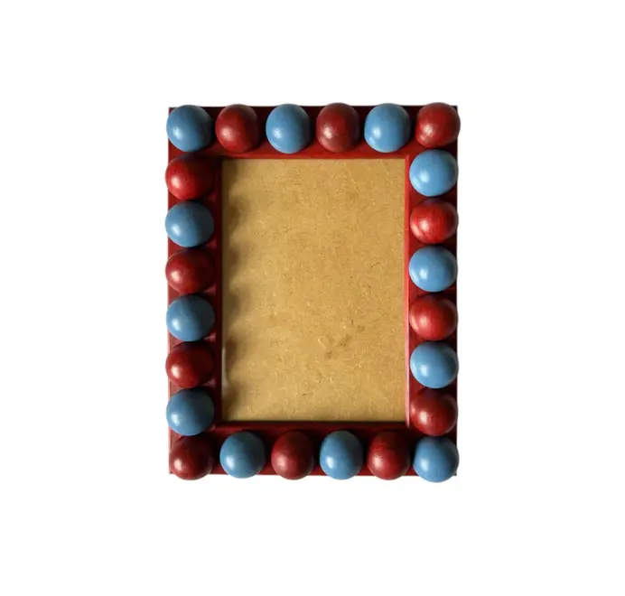 red and blue wood bobbin frame