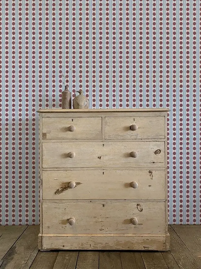 bloomsbury circle stripe wallpaper. wallpaper patterned with blue stripes and burgundy red spots.