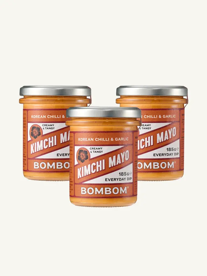 korean kimchi mayo. three jars of kimchi mayonnaise with red labels.