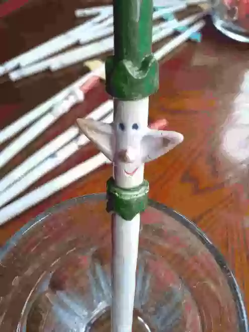 Ceramic Elf Straw in a glass