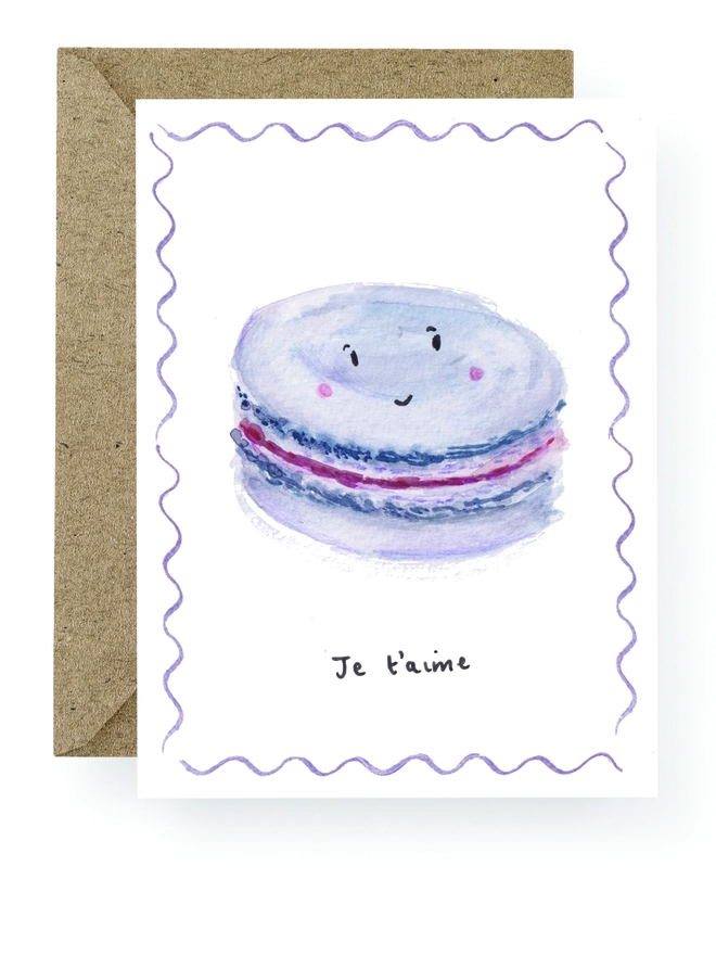 Chic Valentine's Day Card featuring a hand painted Macaron with a smiling face.  The Card reads Je t'aime which means I Love You