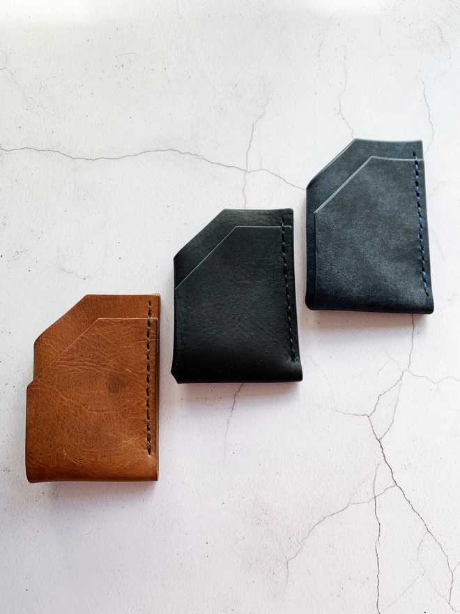 Tan, black and navy leather wallet