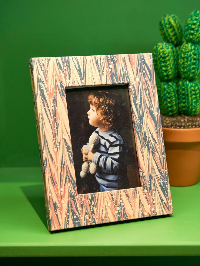 hand marbled photo frame, featuring photo og young child