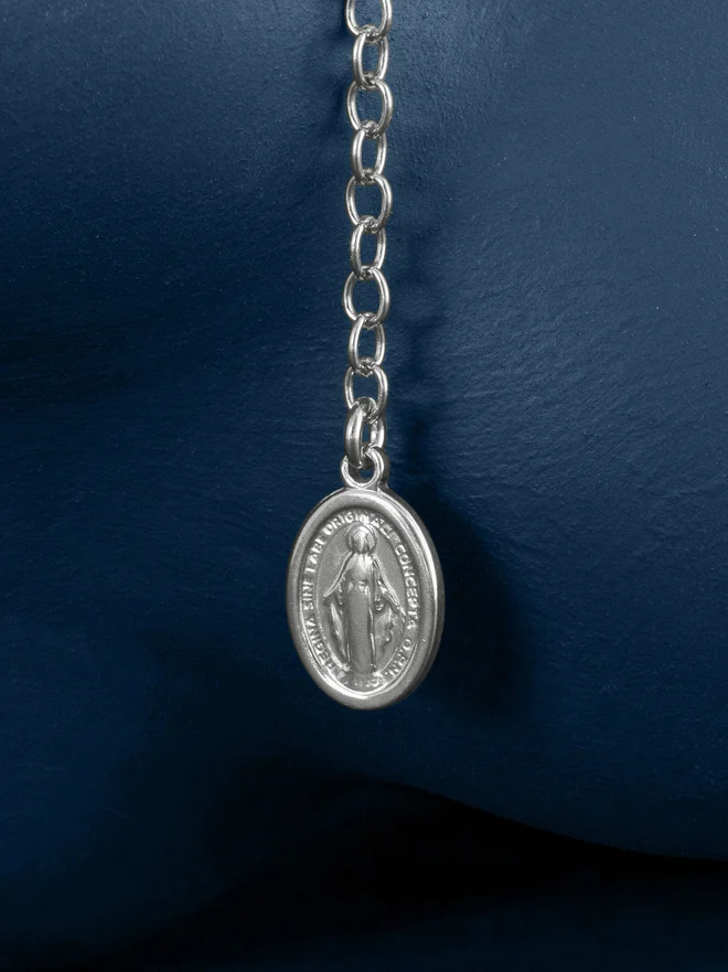 Silver rosary bead chain bracelet close up