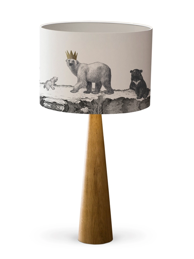 Drum Lampshade featuring bears dragons with a white inner on a wooden base on a white background