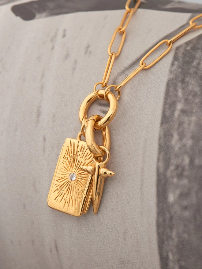 gold necklace with pendants and charms