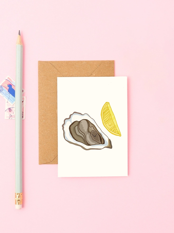Cute mini greeting card featuring a smiley oyster and slice of lemon