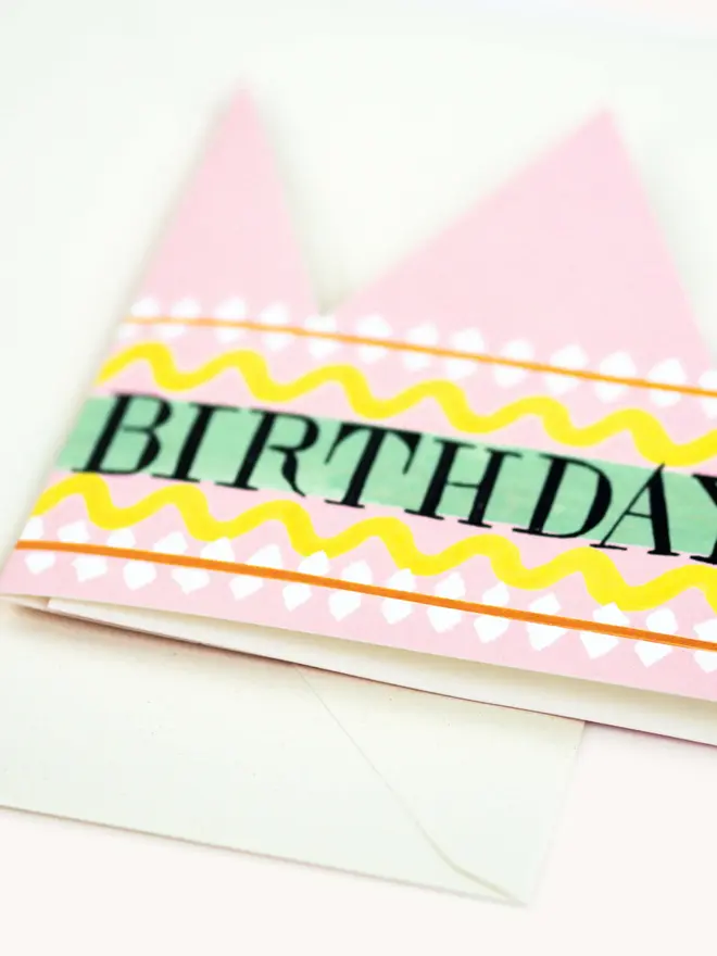 pink and yellow paper crown card with birthday queen text
