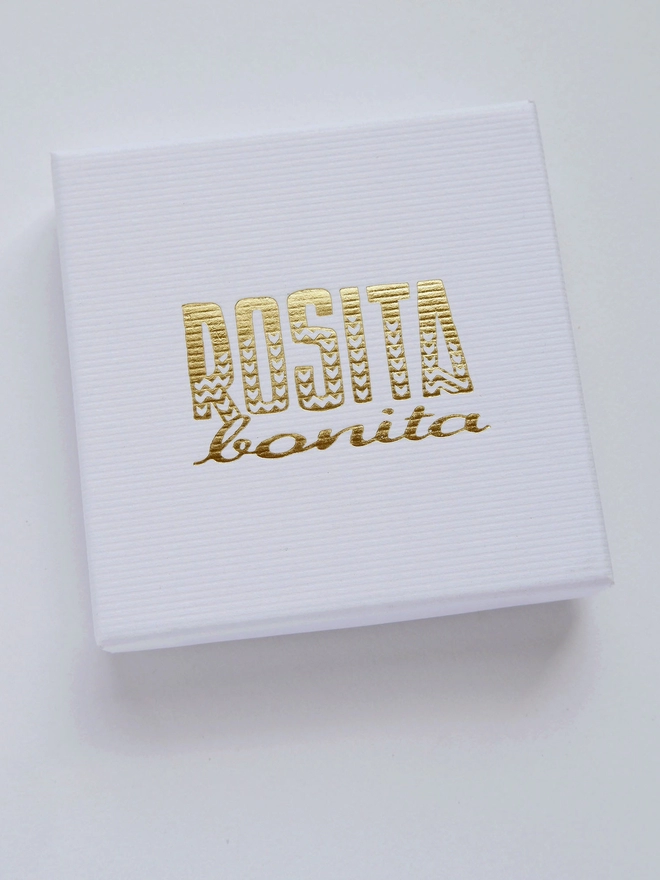 white cardboard box with rosita bonita logo in gold