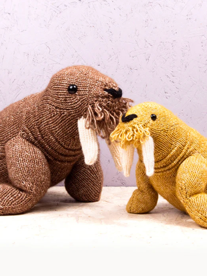Walrus Knitting Kit. One medium, brown walrus and one small, orange walrus.