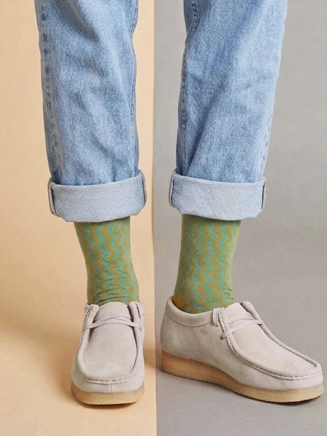 Women's Organic Cotton Ankle Socks Packs (Sets Of 3), a person wearing a pair of colourful patterned socks. 