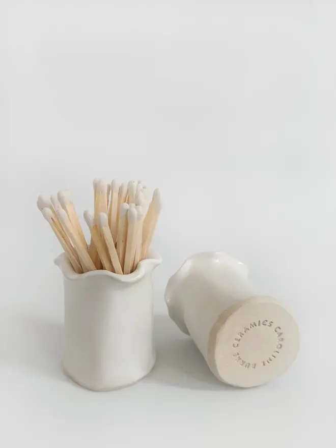 white ceramic matchstick holders