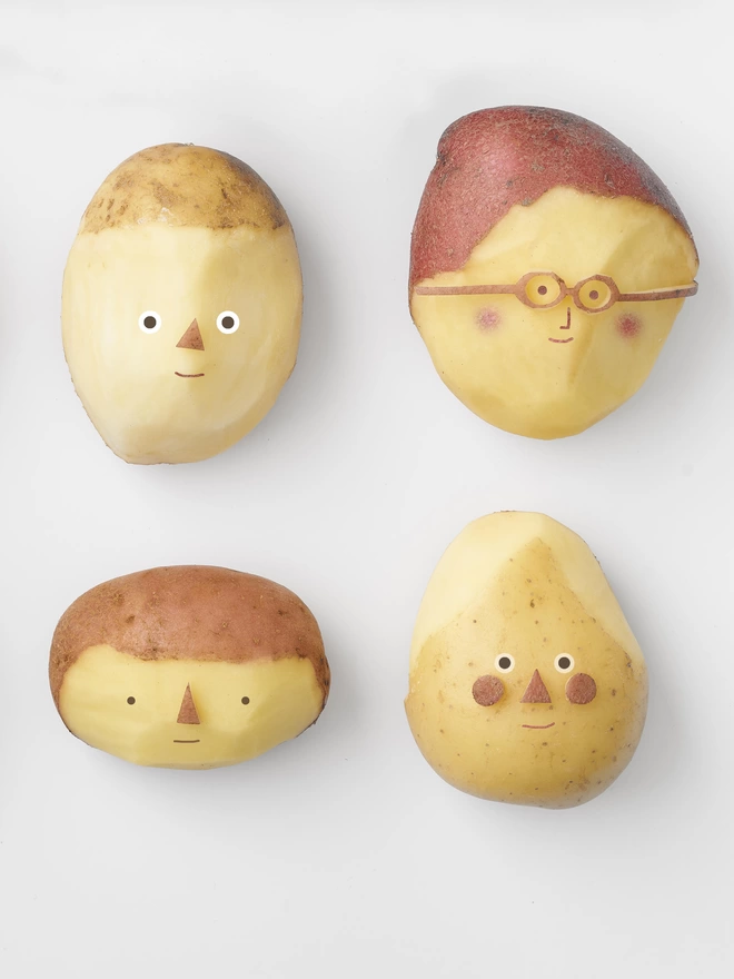 A detail of potatoes with faces 
