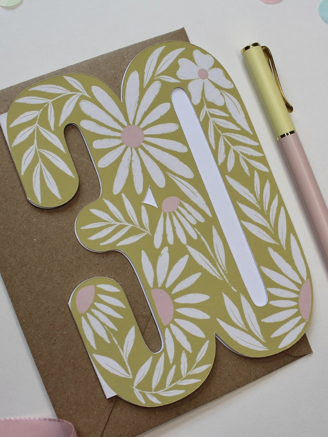 floral 30th birthday card. card shaped like 30 with illustrated daisies.