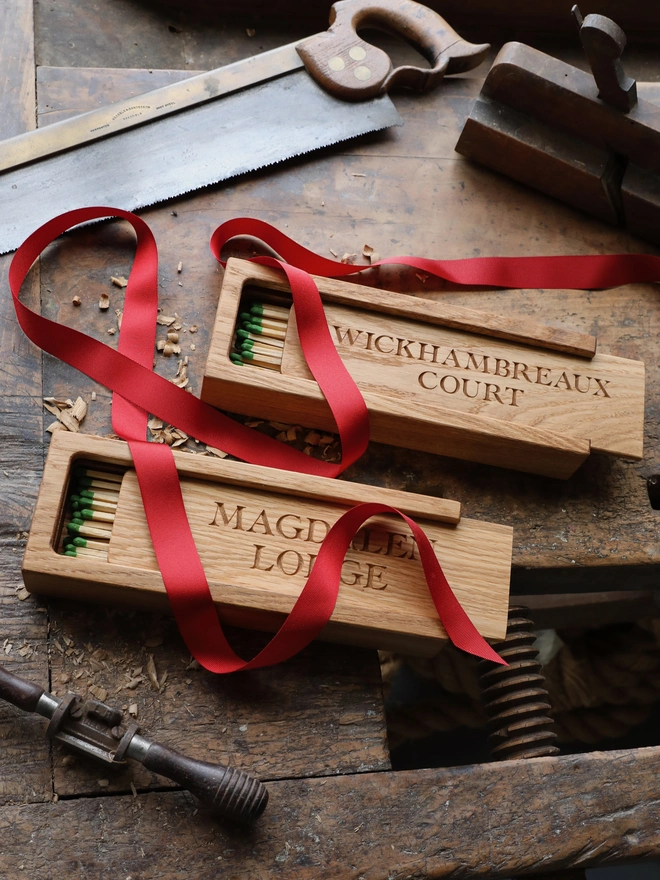 Jumbo Matchboxes on workbench with tools