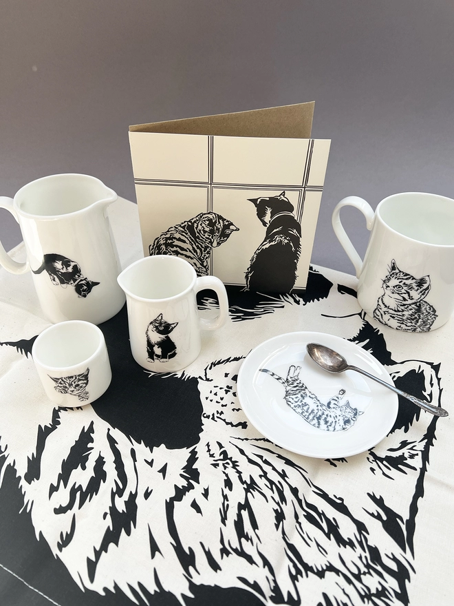 Other cat products including ceramics and tea towel
