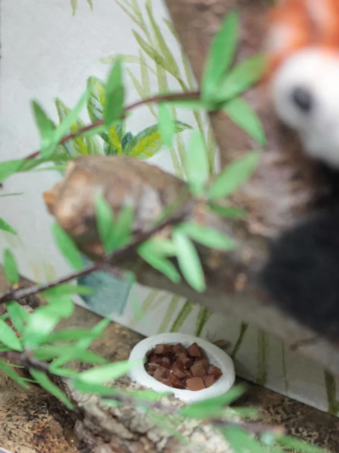 Close up of a miniature bowl of food in a ceramic bowl 