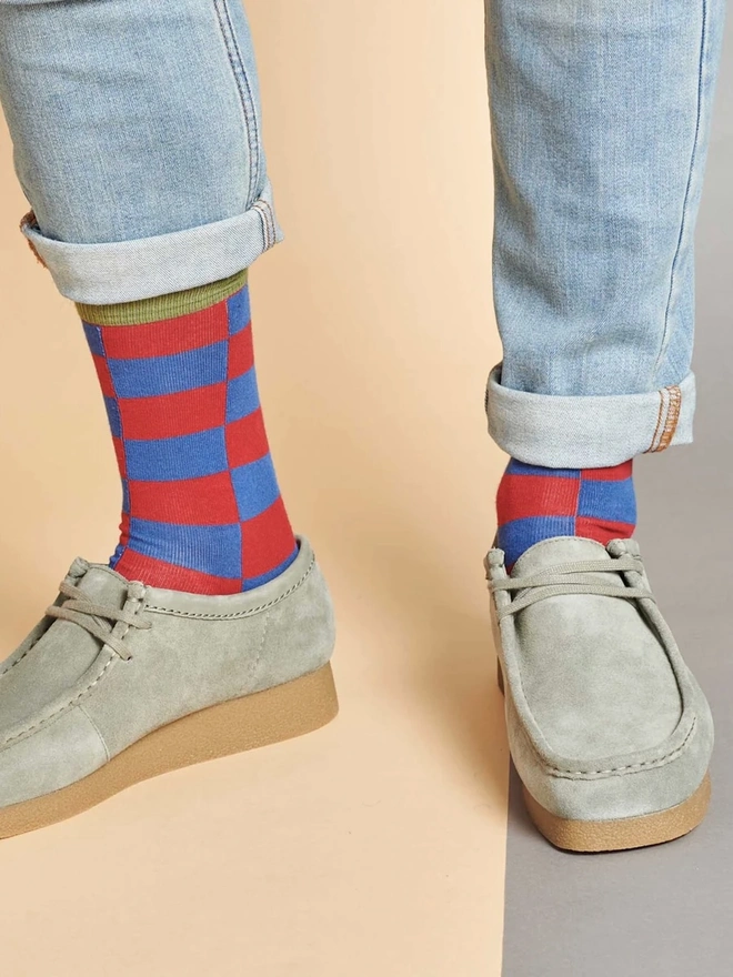 Men's Organic Cotton Ankle Socks Packs (Sets Of 3), a man wearing a pair of colourful patterned socks. 